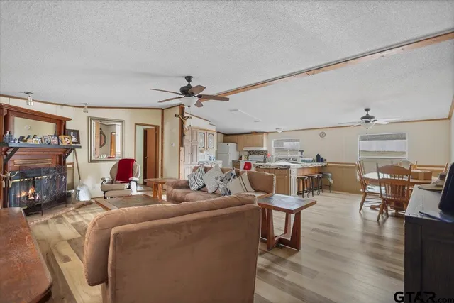 a kitchen with stainless steel appliances granite countertop a stove and a refrigerator