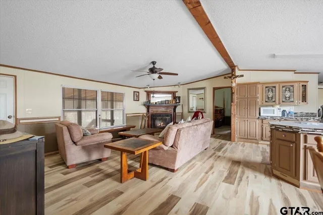 a view of a dining room with furniture and a chandelier