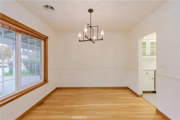 a kitchen with stainless steel appliances a sink stove and cabinets