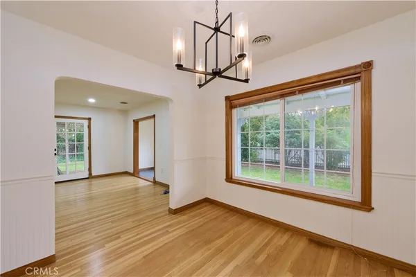 a kitchen with granite countertop white cabinets and sink