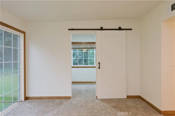 a view of an empty room with a window