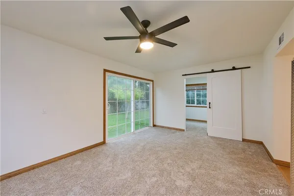 a view of empty room with windows