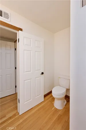 an empty room with a ceiling fan and carpet