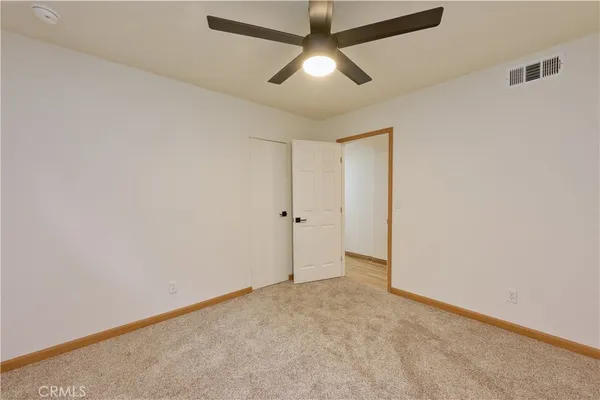 a bathroom with a shower a toilet and a sink