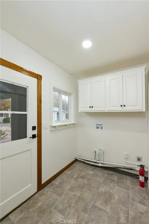 a kitchen with stainless steel appliances granite countertop a sink and cabinets