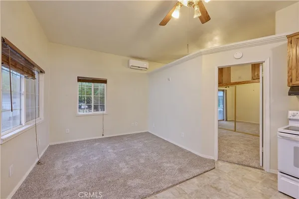 a view of a yard in front of a house with large trees