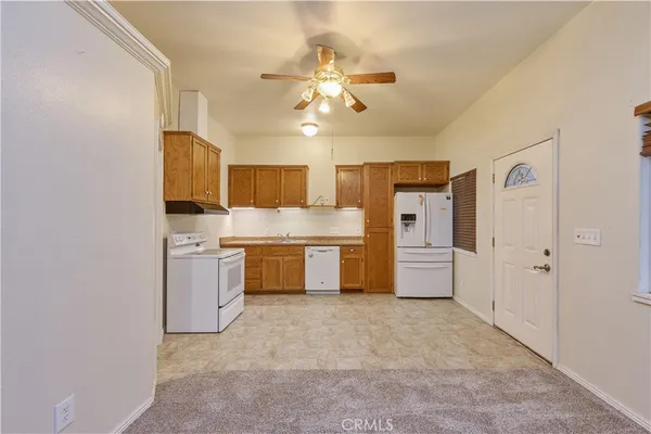 a front view of a house with a garden and outdoor seating