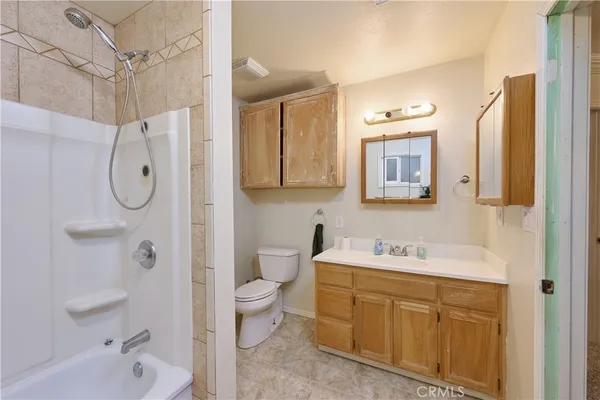 a view of a house with a yard and garage