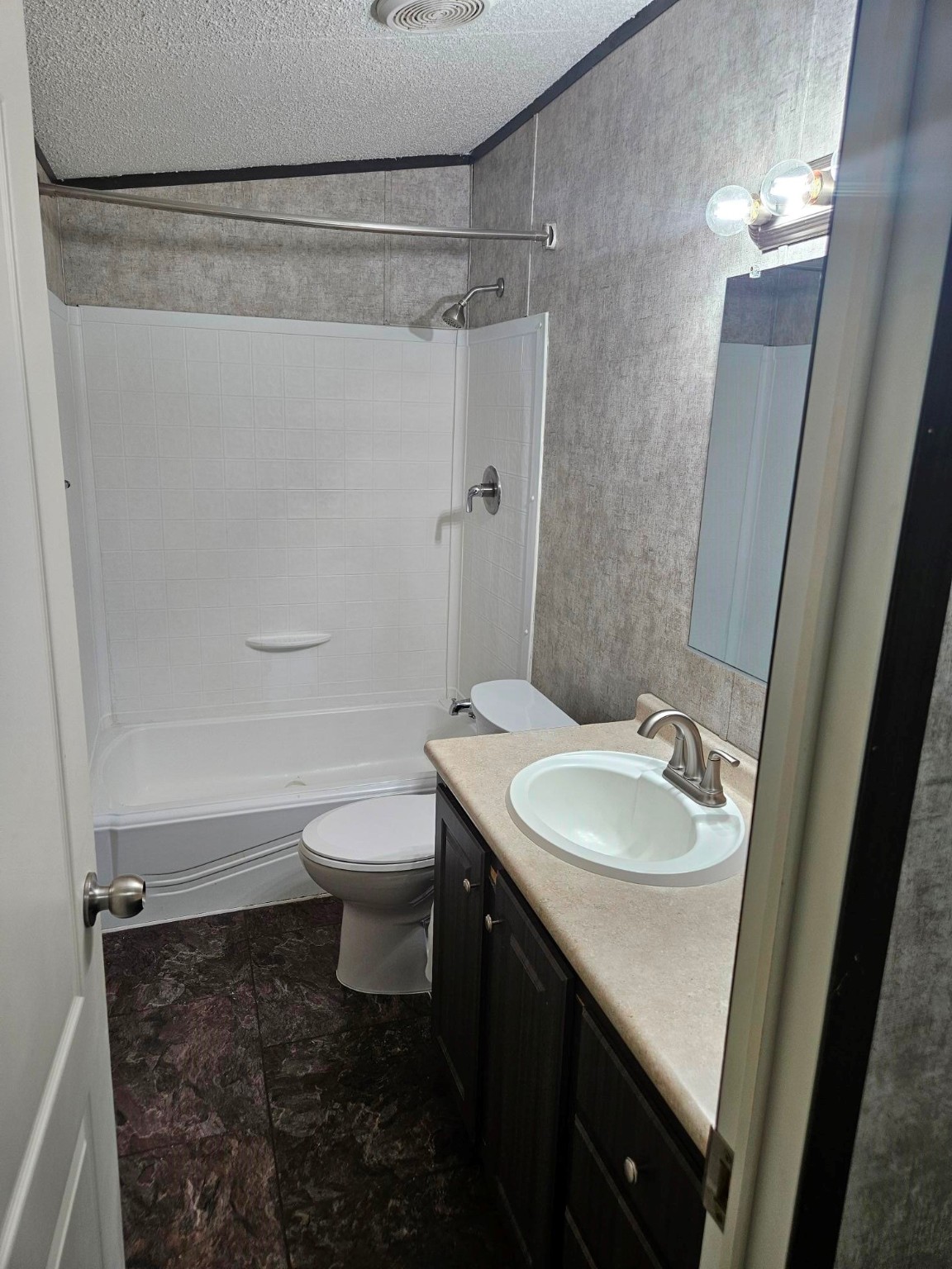 675 5604th Corner Cleveland, TX 77327 - Photo 13 of 13 a bathroom with a sink a toilet and shower