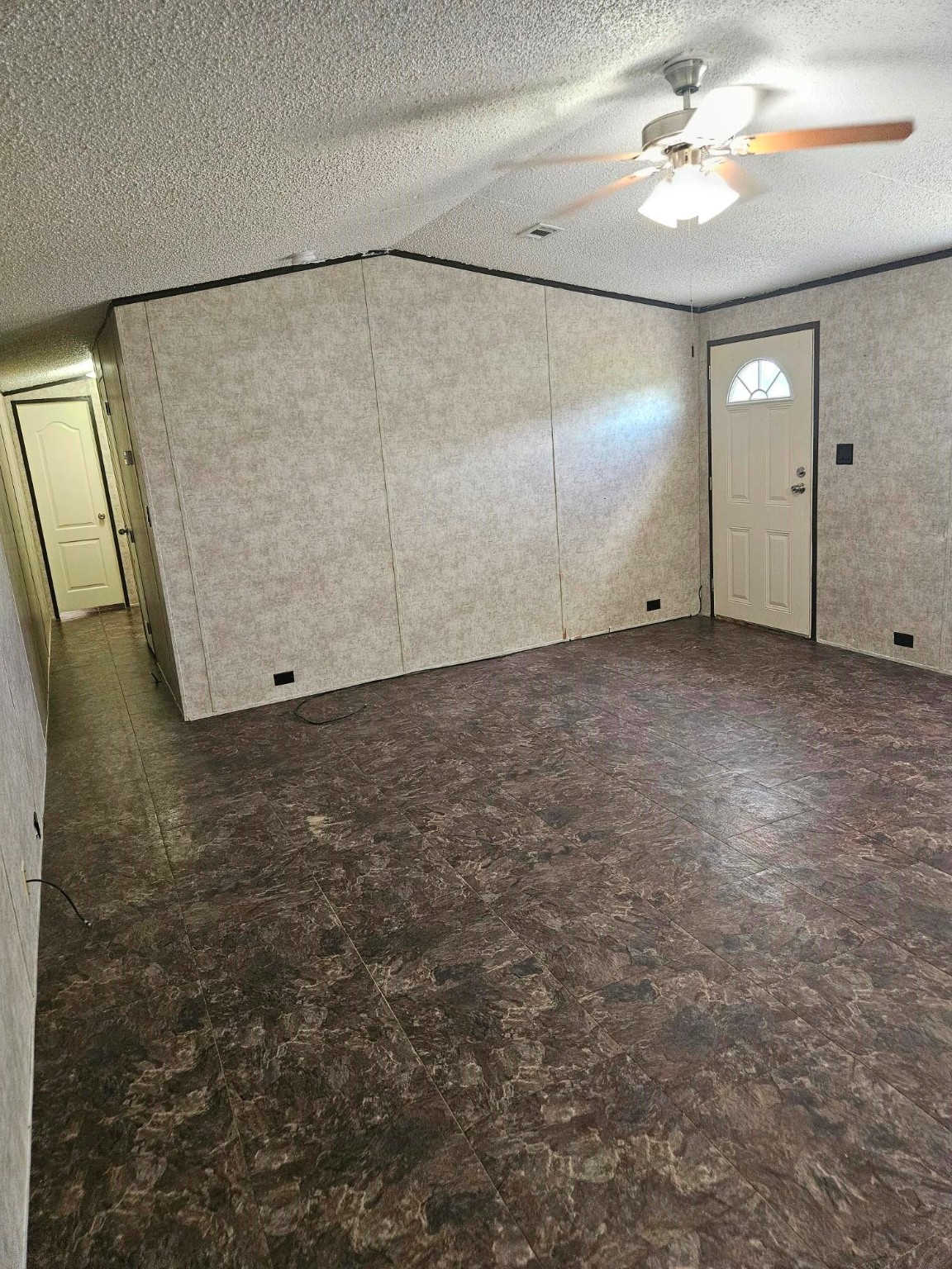 675 5604th Corner Cleveland, TX 77327 - Photo 6 of 13 an empty room with windows & fan