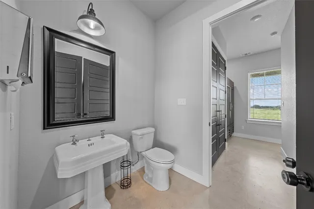 a view of an empty room and bathroom