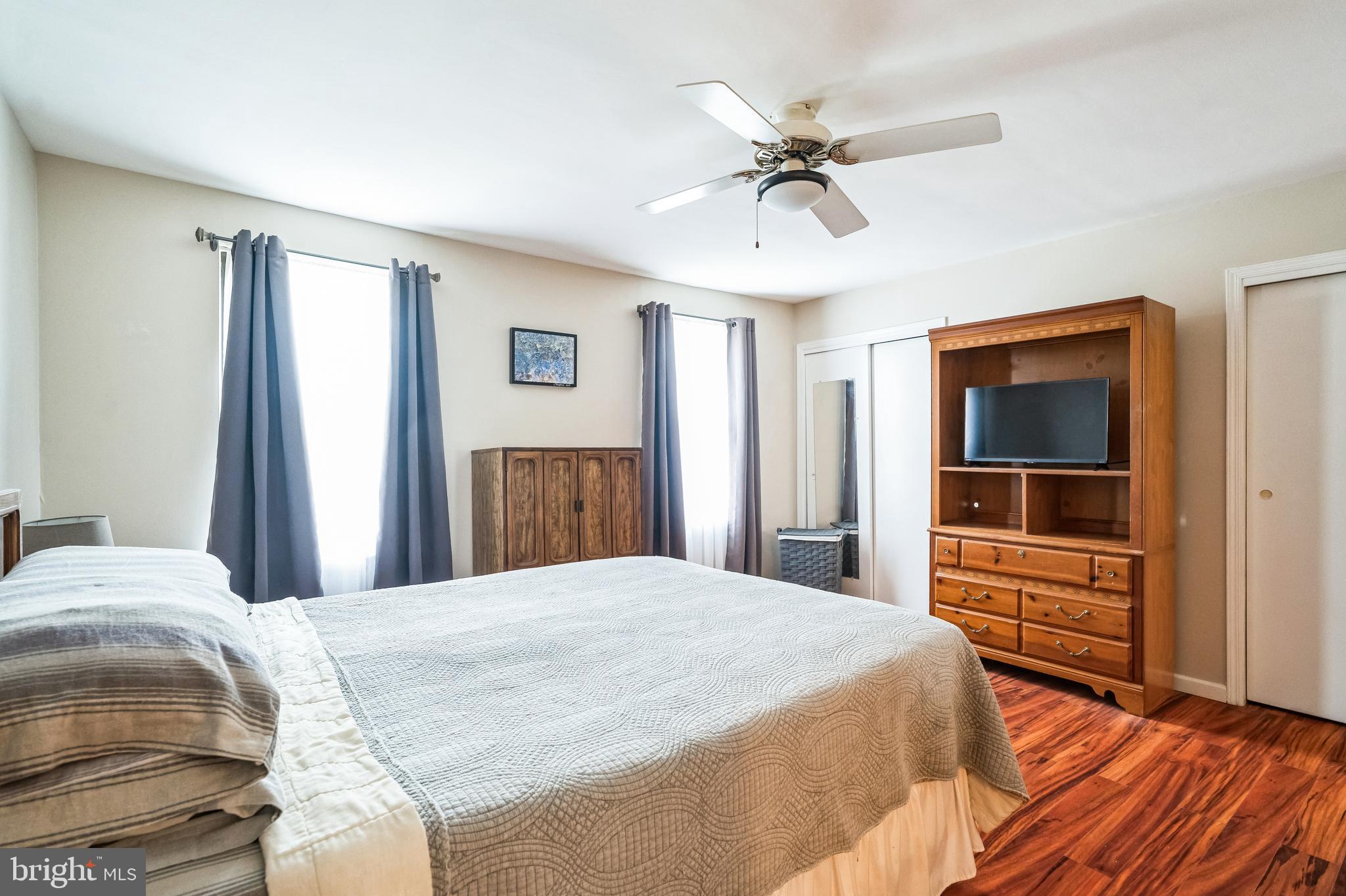 806 Kings Croft Drive Cherry Hill, NJ 08034 - Photo 21 of 31 a bedroom with a large bed and a chandelier