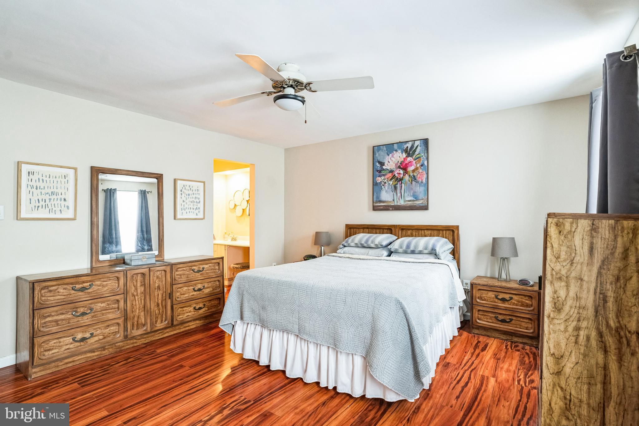 806 Kings Croft Drive Cherry Hill, NJ 08034 - Photo 23 of 31 a bedroom with a bed and wooden floor