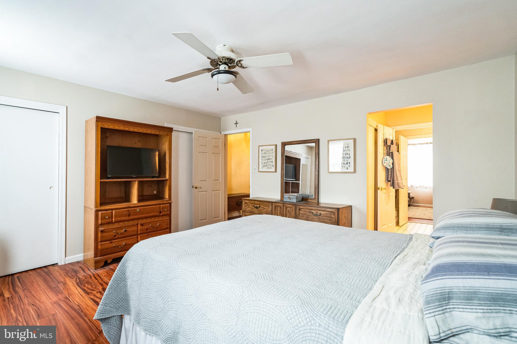 806 Kings Croft Drive Cherry Hill, NJ 08034 - Photo 24 of 31 a bedroom with a large bed and a chandelier