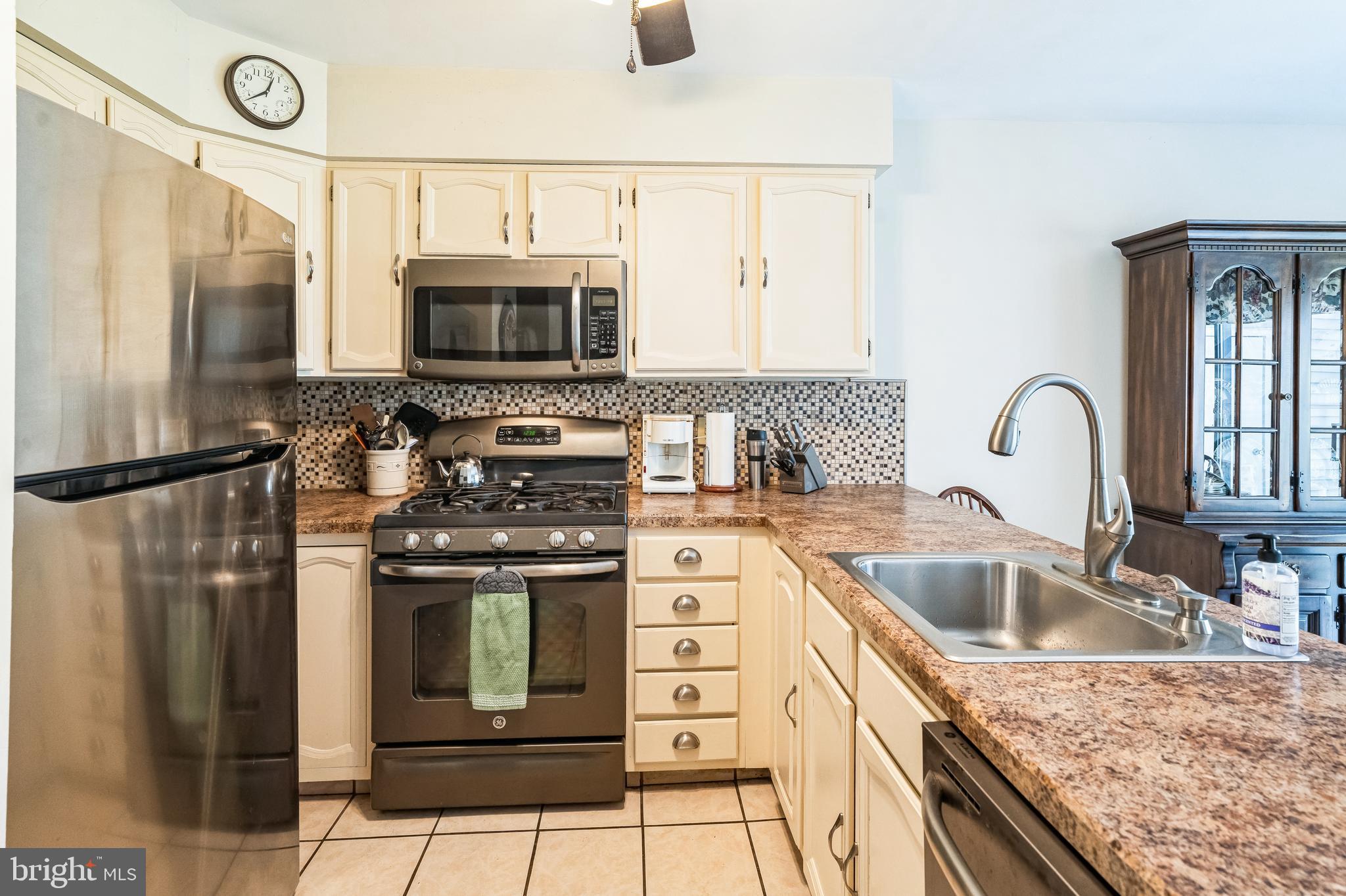 806 Kings Croft Drive Cherry Hill, NJ 08034 - Photo 7 of 31 a kitchen with stainless steel appliances granite countertop a sink stove and refrigerator