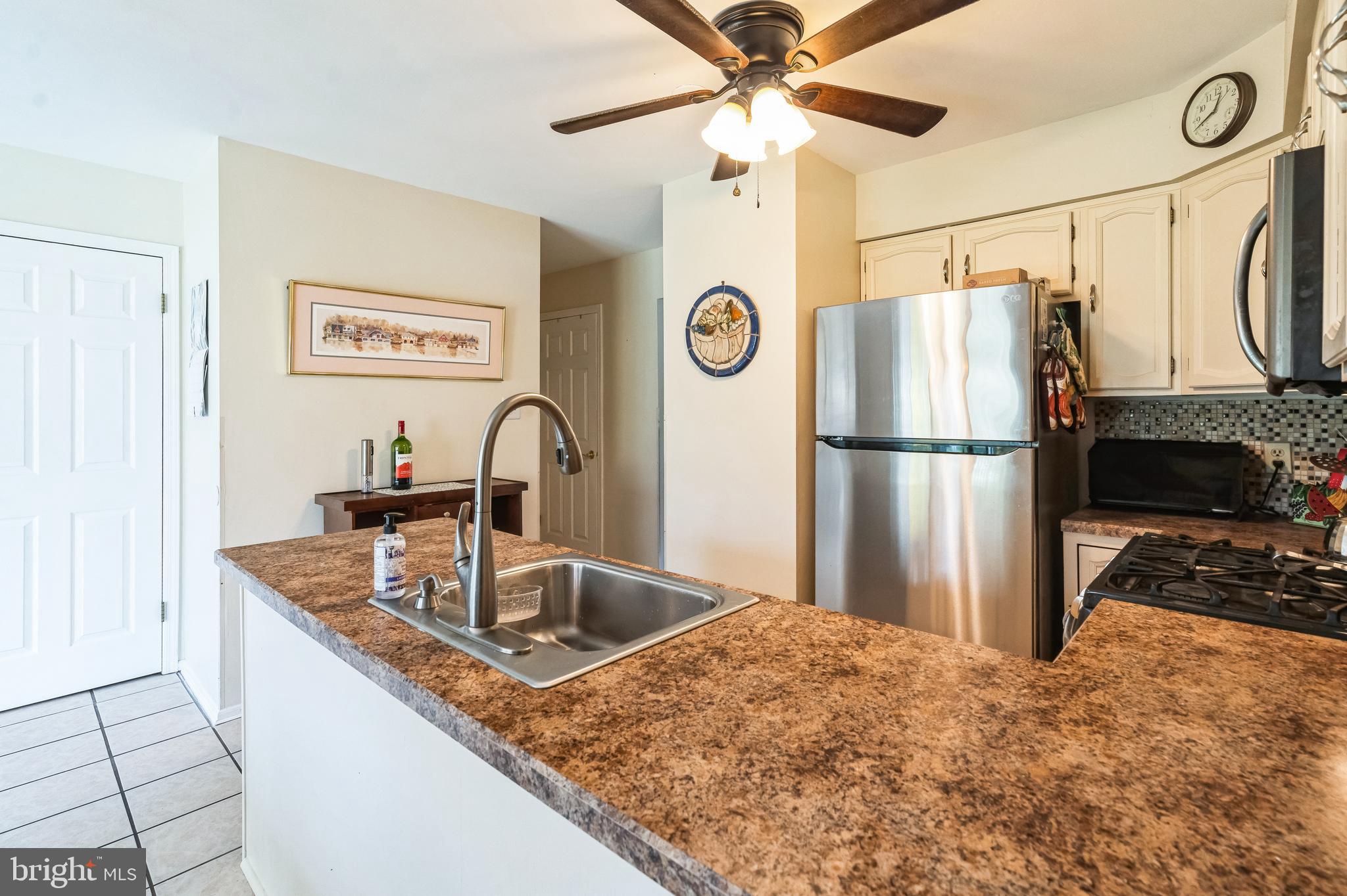 806 Kings Croft Drive Cherry Hill, NJ 08034 - Photo 10 of 31 a kitchen with stainless steel appliances granite countertop a refrigerator a sink and a stove