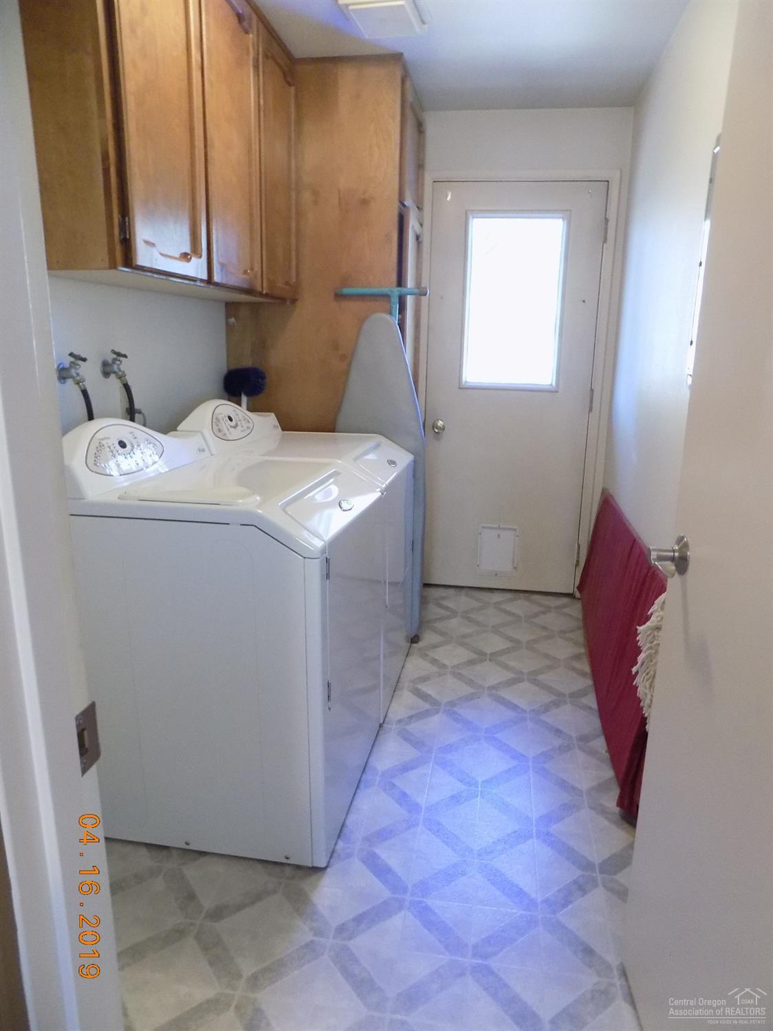 18853 Shoshone Road Bend, OR 97702 - Photo 13 of 25 Laundry room with storage, and access to