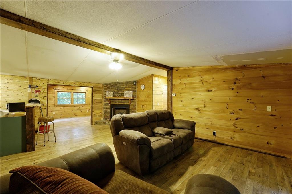 192 Bushy Head Road Cherry Log, GA 30522 - Photo 8 of 13 a living room with fireplace furniture and a flat screen tv