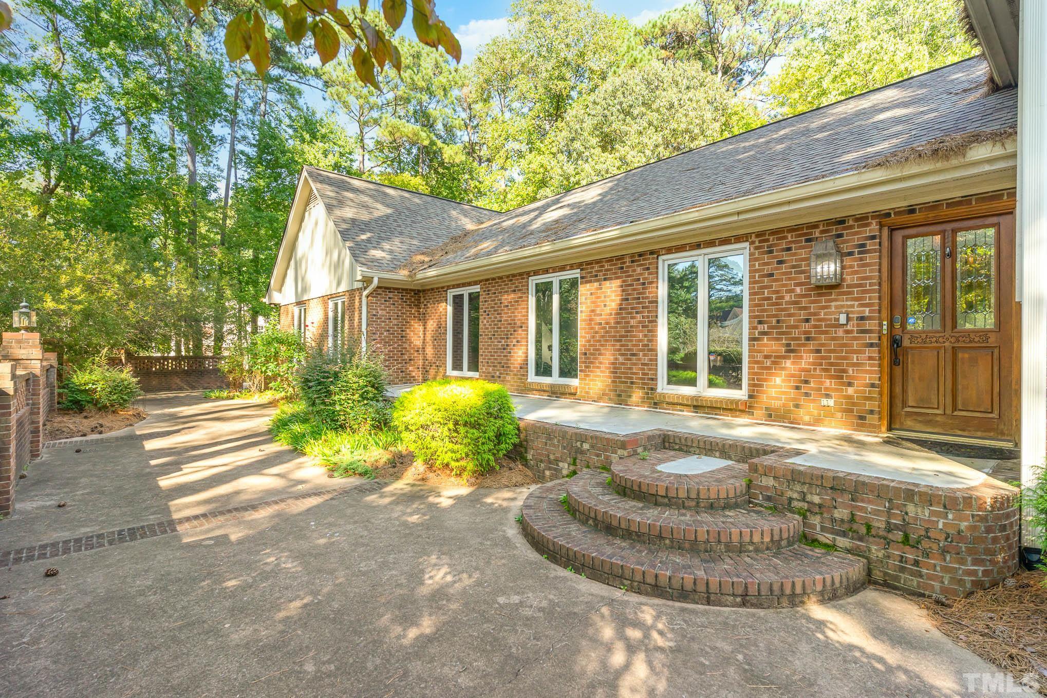 8700 Stage Ford Road Raleigh, NC 27615 - Photo 2 of 25 a view of a house with backyard and porch