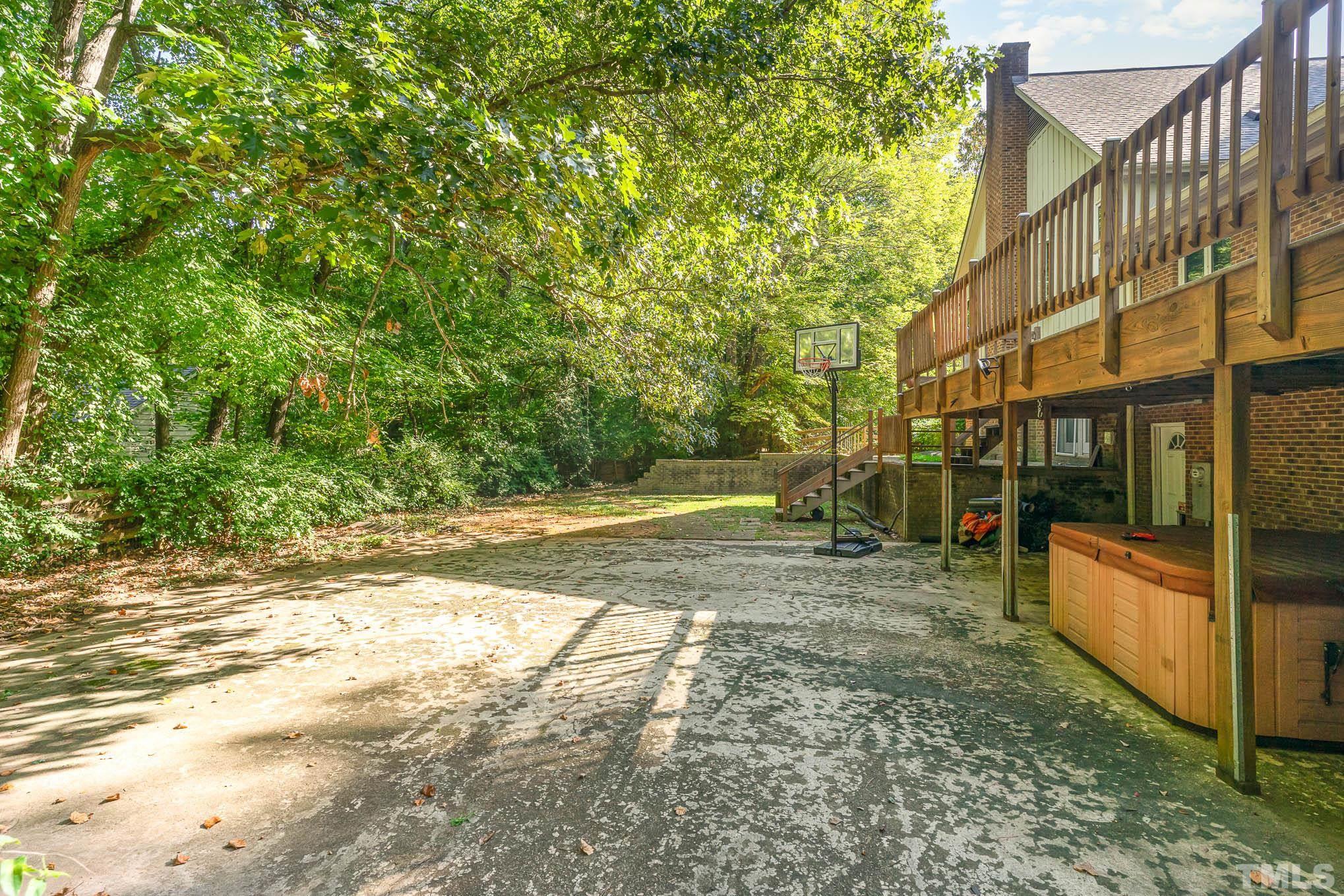 8700 Stage Ford Road Raleigh, NC 27615 - Photo 22 of 25 a view of a yard with plants and large tree