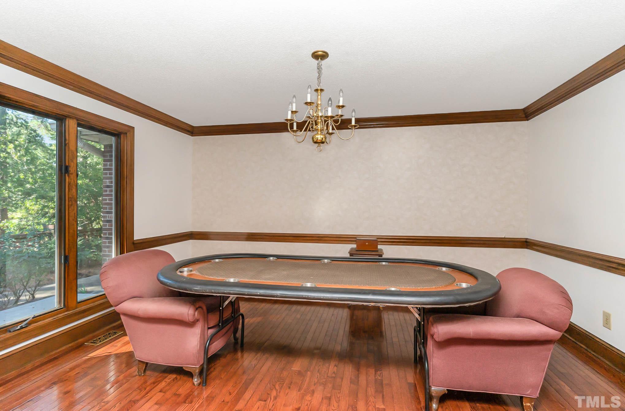 8700 Stage Ford Road Raleigh, NC 27615 - Photo 5 of 25 a room with pool table and windows
