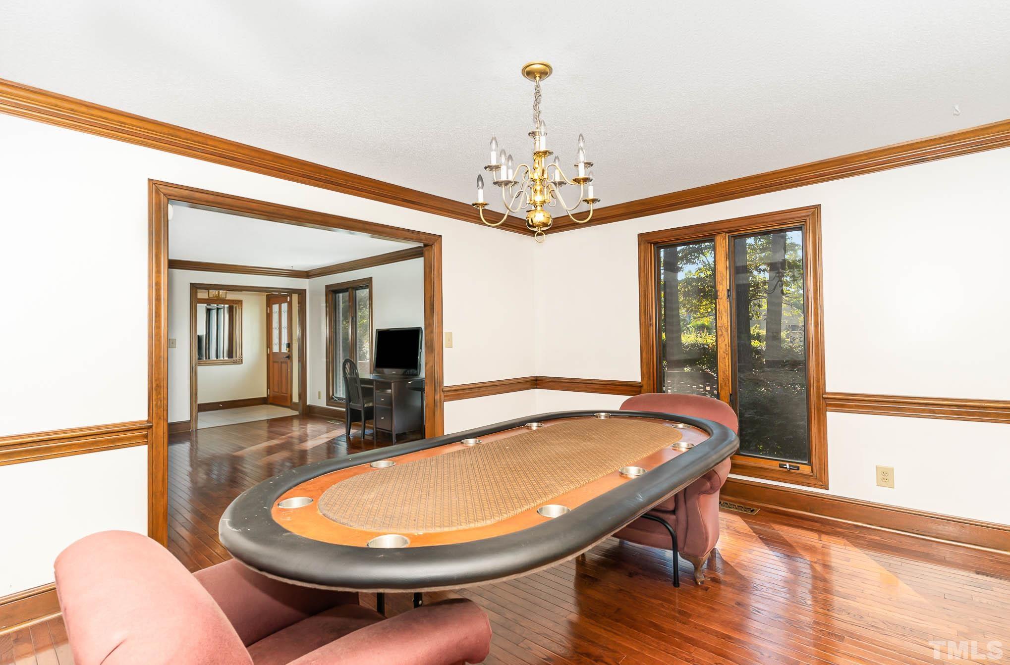 8700 Stage Ford Road Raleigh, NC 27615 - Photo 6 of 25 a view of a dining room with furniture window and wooden floor