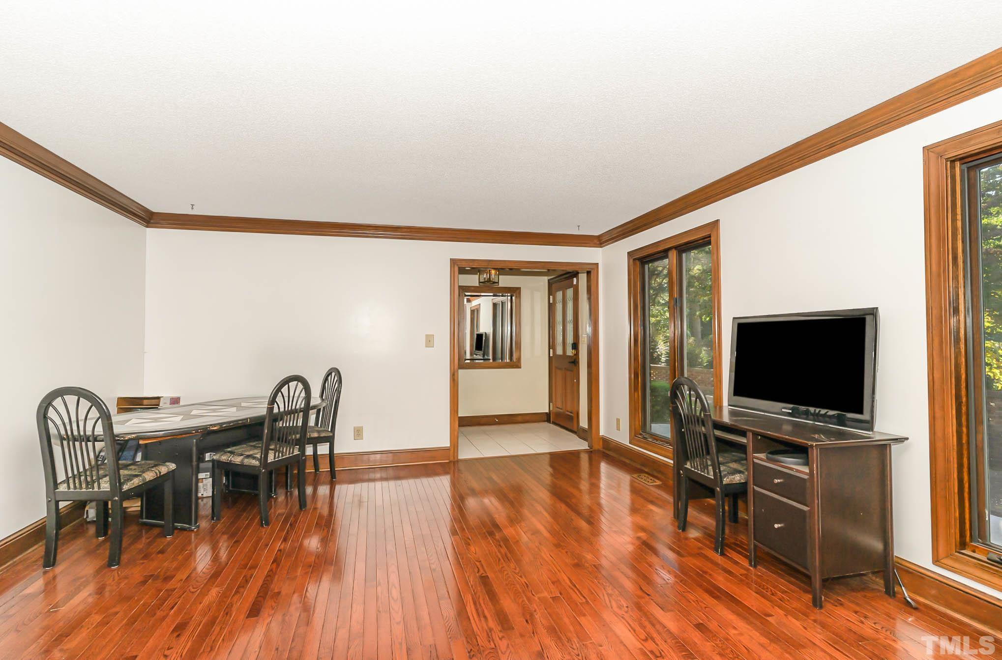 8700 Stage Ford Road Raleigh, NC 27615 - Photo 7 of 25 a living room with furniture and a flat screen tv