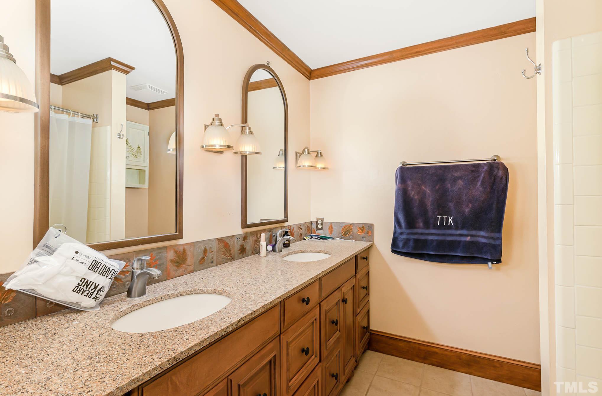 8700 Stage Ford Road Raleigh, NC 27615 - Photo 8 of 25 a bathroom with a granite countertop sink and a mirror