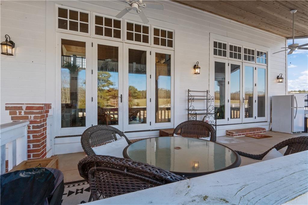 31 Duck Pond Road Roopville, GA 30170 - Photo 105 of 136 a table and chair sitting in front of a building