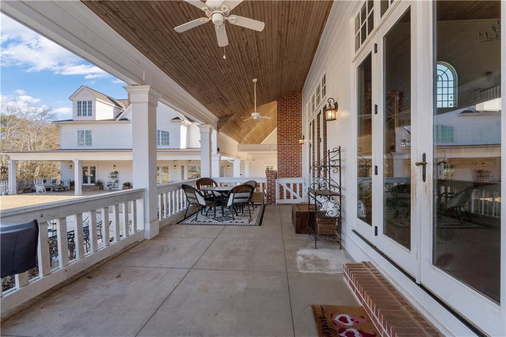 31 Duck Pond Road Roopville, GA 30170 - Photo 113 of 136 a building outdoor space with patio furniture and potted plants