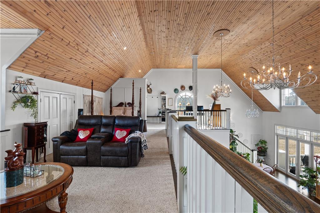 31 Duck Pond Road Roopville, GA 30170 - Photo 120 of 136 a living room with furniture and kitchen view