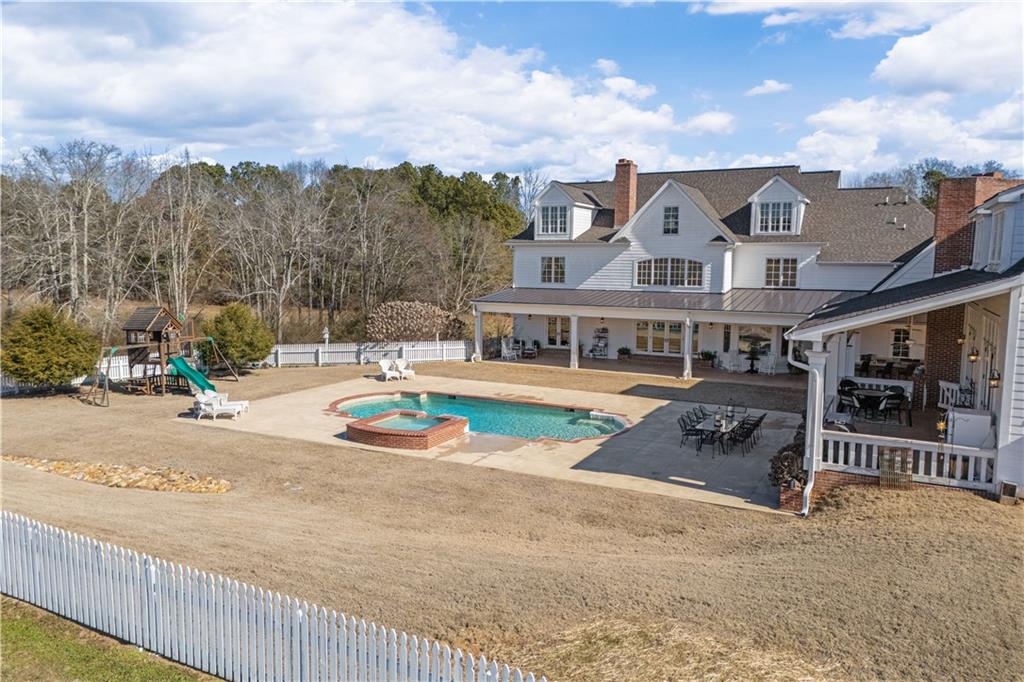 31 Duck Pond Road Roopville, GA 30170 - Photo 12 of 136 a view of a big building with a big yard and large trees