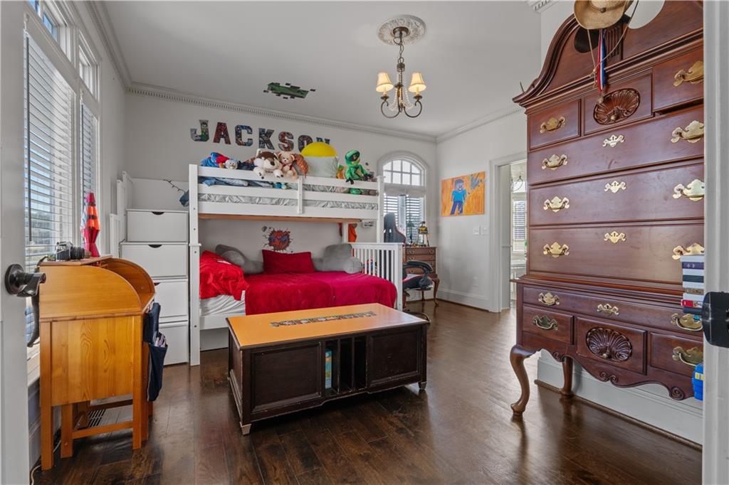 31 Duck Pond Road Roopville, GA 30170 - Photo 123 of 136 a bedroom with a bed and wooden floor