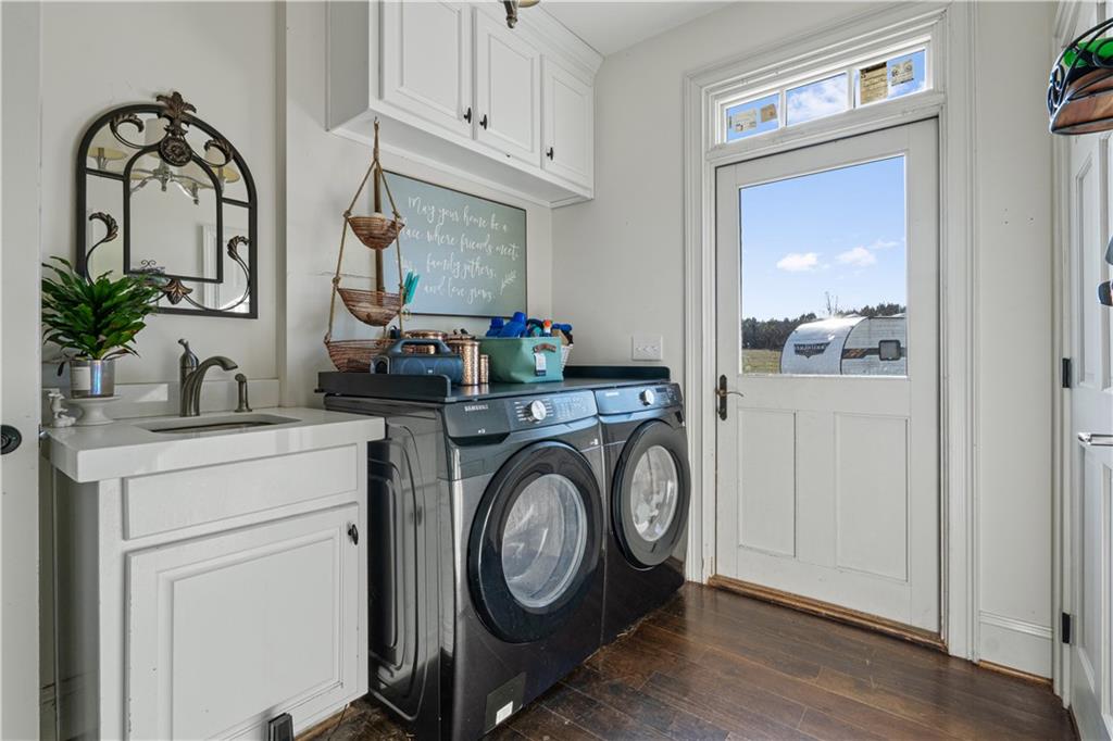 31 Duck Pond Road Roopville, GA 30170 - Photo 132 of 136 a view of storage and utility room with washer and dryer