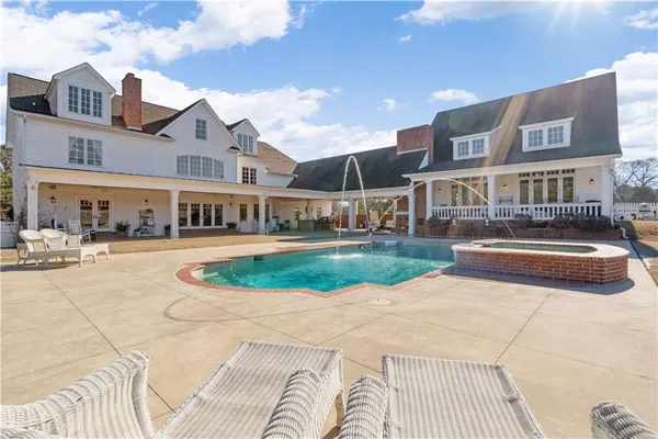 a view of a yard with an outdoor seating