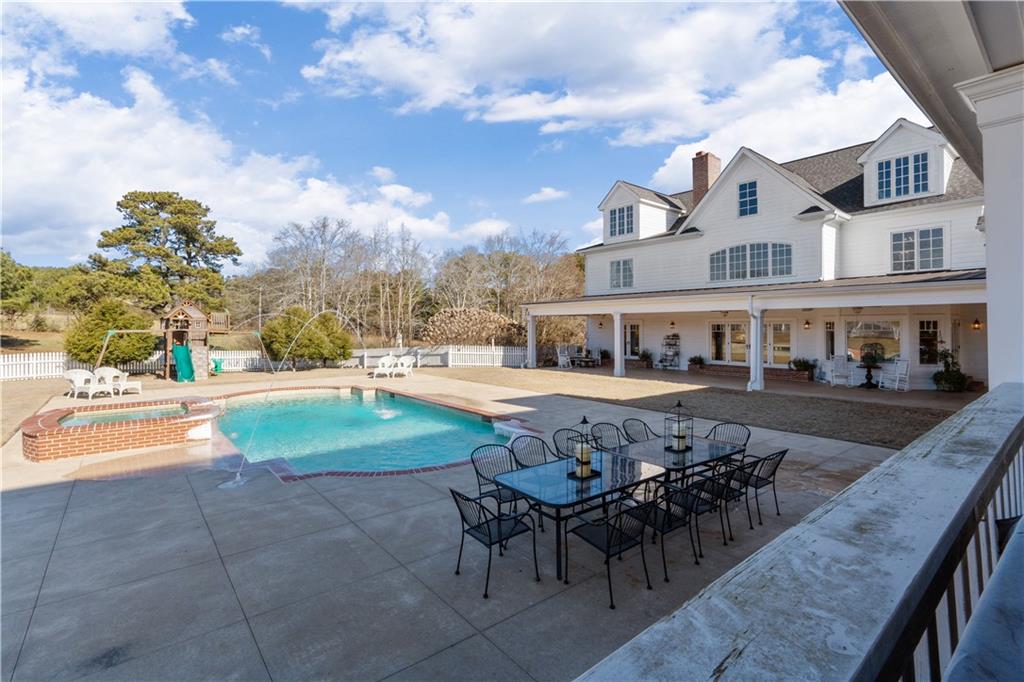31 Duck Pond Road Roopville, GA 30170 - Photo 18 of 136 a view of a house with swimming pool and sitting area