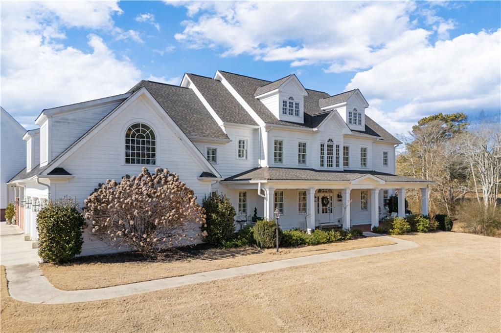 31 Duck Pond Road Roopville, GA 30170 - Photo 2 of 136 a front view of a house with a garden