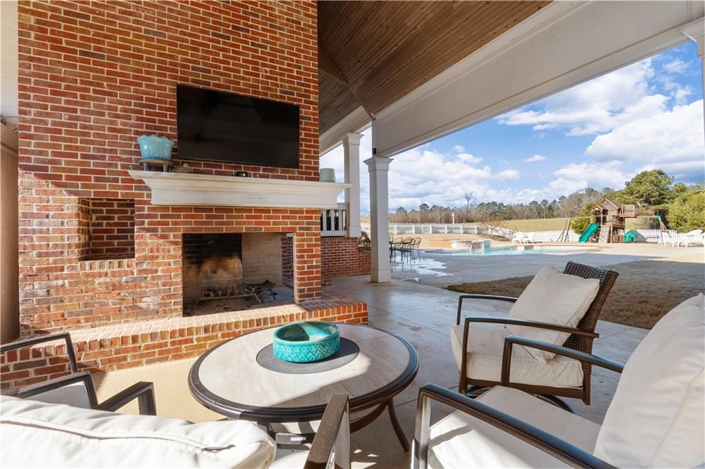 31 Duck Pond Road Roopville, GA 30170 - Photo 24 of 136 a backyard of a house with fire pit table and chairs