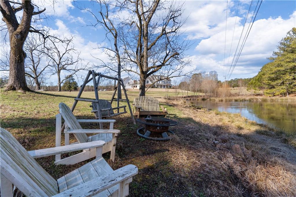 31 Duck Pond Road Roopville, GA 30170 - Photo 28 of 136 a view of a yard with an outdoor seating