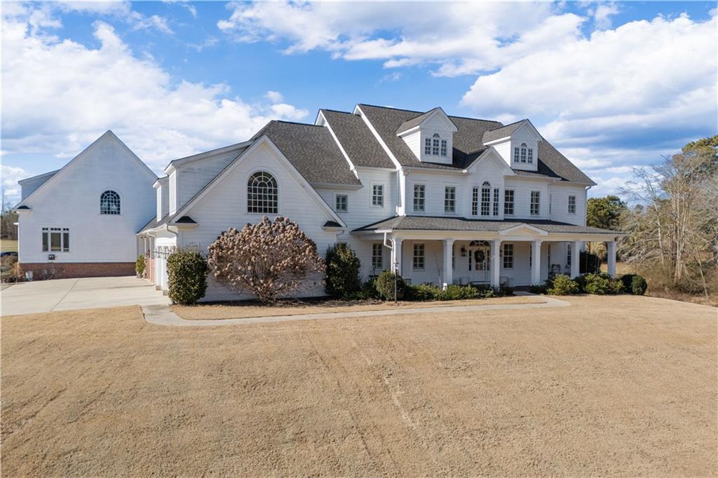 31 Duck Pond Road Roopville, GA 30170 - Photo 3 of 136 a front view of a house with a yard