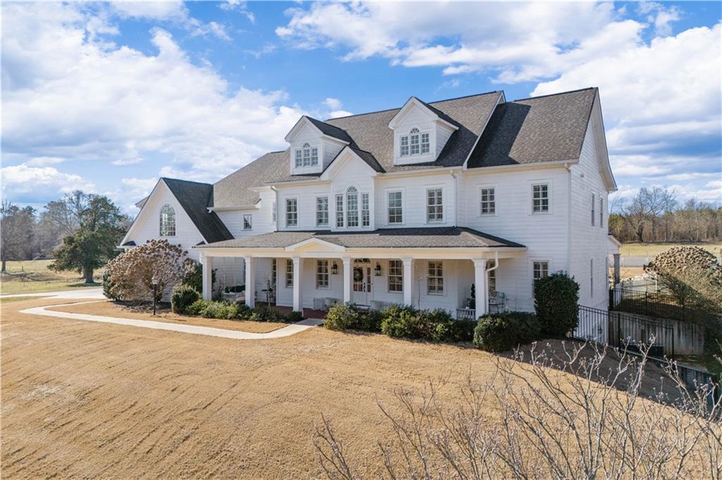 31 Duck Pond Road Roopville, GA 30170 - Photo 4 of 136 a front view of a house with a yard