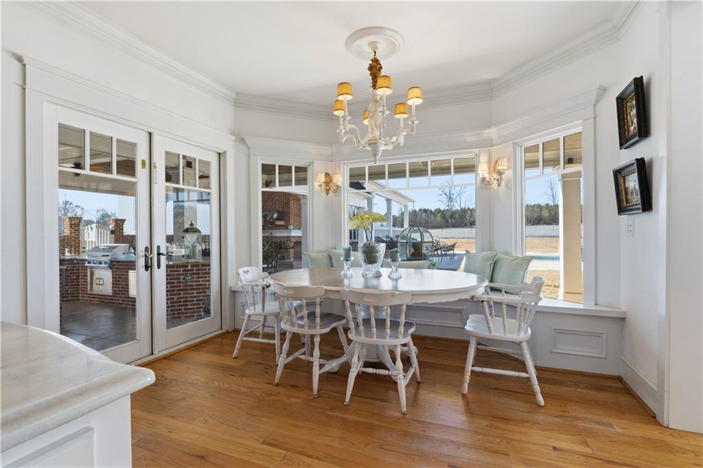 31 Duck Pond Road Roopville, GA 30170 - Photo 42 of 136 a view of a dining room with furniture window and wooden floor