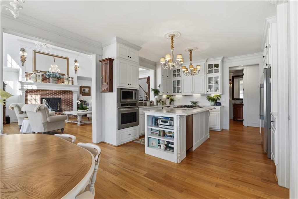 31 Duck Pond Road Roopville, GA 30170 - Photo 43 of 136 a kitchen with stainless steel appliances kitchen island granite countertop a stove and a refrigerator