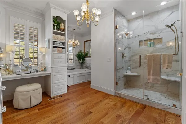 a living room with furniture fireplace and a potted plant