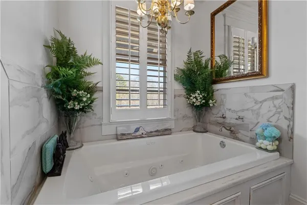a living room with furniture ceiling fan and a fireplace
