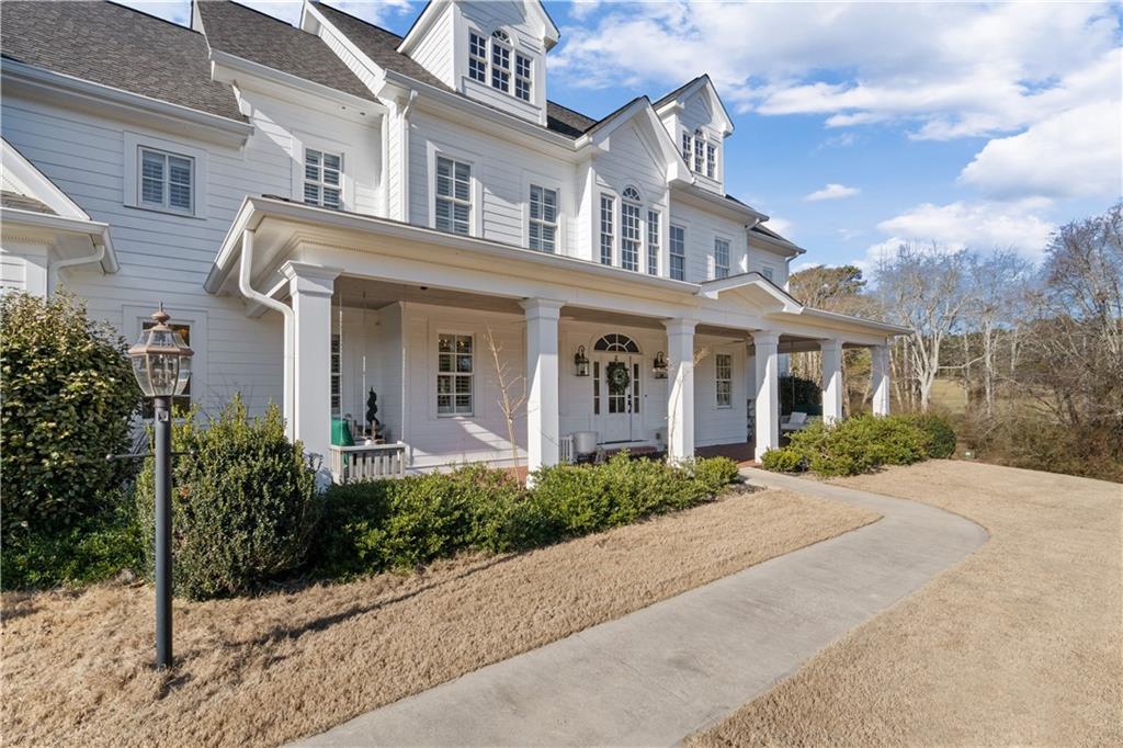 31 Duck Pond Road Roopville, GA 30170 - Photo 6 of 136 a front view of a house with yard and tress