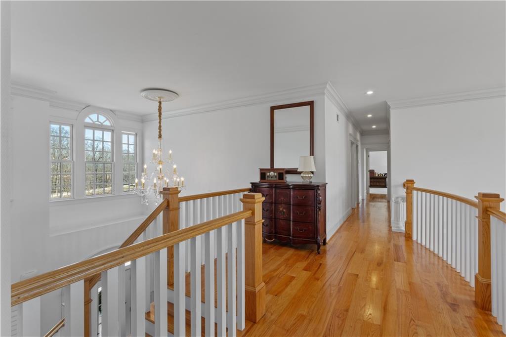 31 Duck Pond Road Roopville, GA 30170 - Photo 63 of 136 a view of a hallway with the wooden floor and staircase
