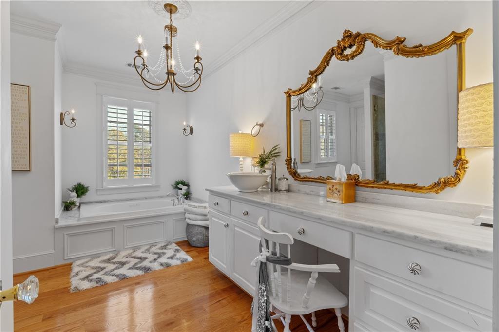31 Duck Pond Road Roopville, GA 30170 - Photo 67 of 136 a spacious bathroom with a sink a mirror a bathtub and a window