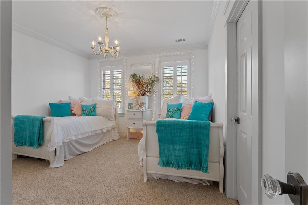 31 Duck Pond Road Roopville, GA 30170 - Photo 71 of 136 a living room with furniture and a chandelier