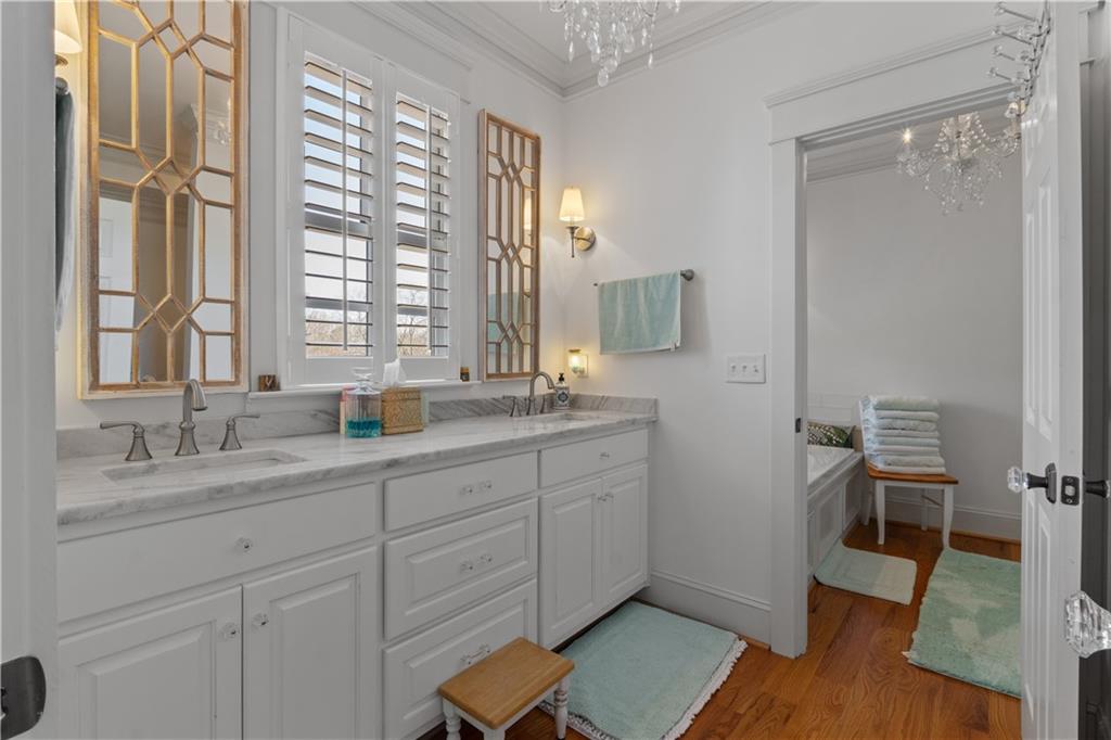 31 Duck Pond Road Roopville, GA 30170 - Photo 73 of 136 a spacious bathroom with double vanity sink a mirror and a shower
